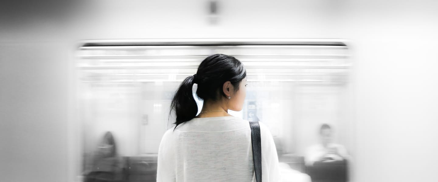 Woman waiting on a train platform